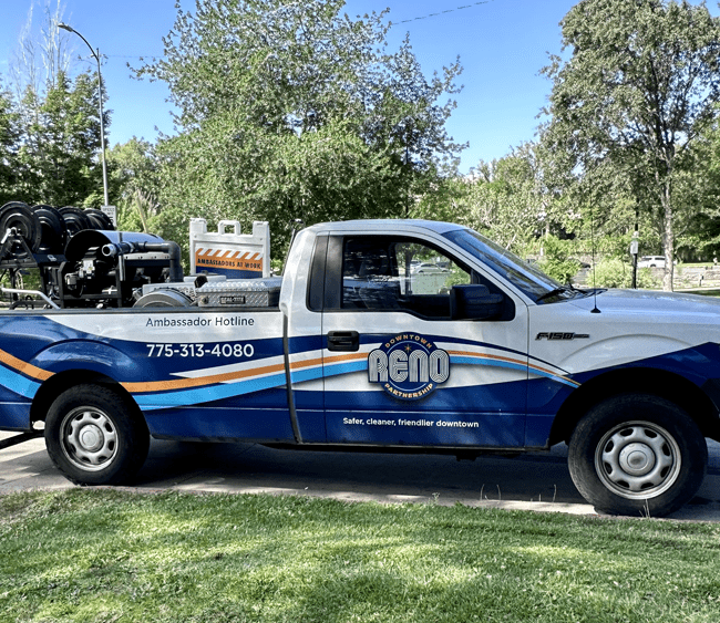 DRP Cleaning Truck parked infront of the River and park.