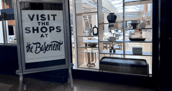 Sign reading "Visit the Shops at the Basement," inside of the Basement building.